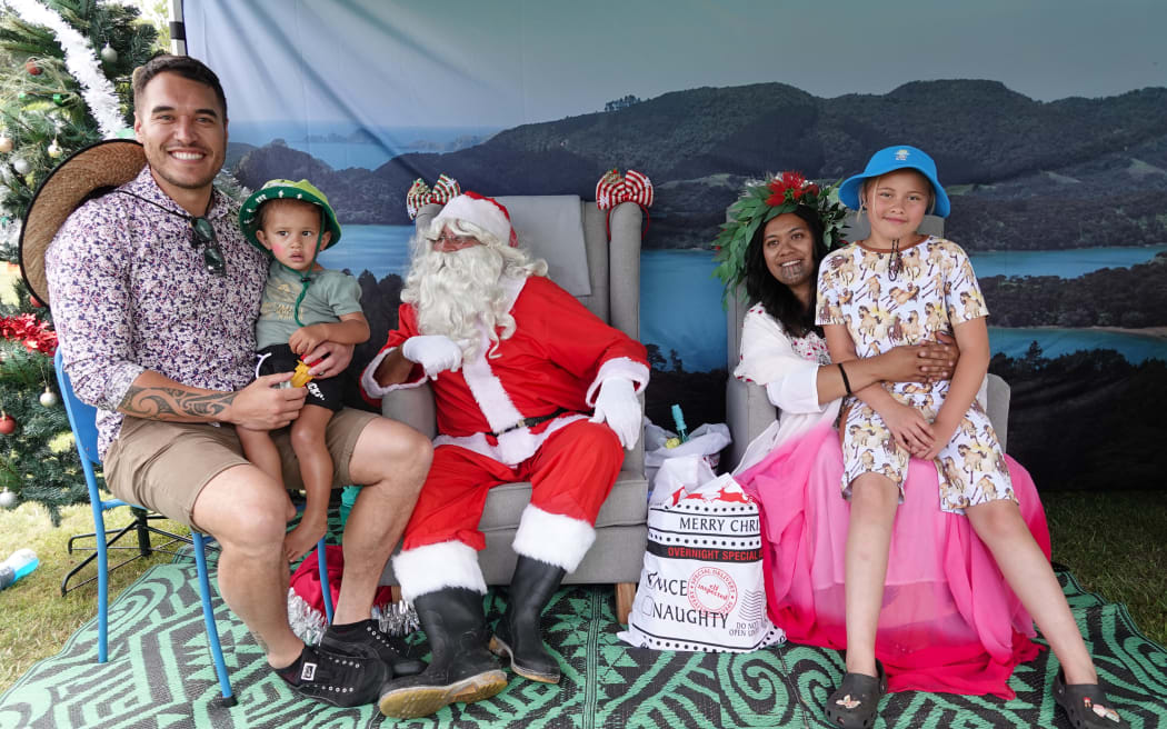 Far North Mayor Moko Tepania introduces a nephew and niece to Santa and Hineraumati (Charlotte Morunga).