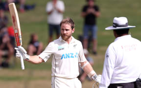 New Zealand’s Kane Williamson celebrates his century during day four of the second cricket test match between New Zealand and South Africa at Seddon Park in Hamilton on February 16, 2024. (Photo by Fiona Goodall / AFP)