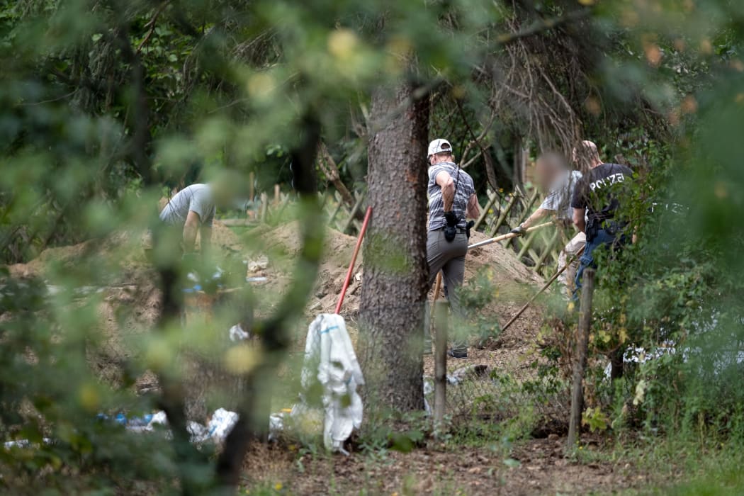 Police search an allotment in the Hanover suburb of Seelze in their investigation of the disappearance of British toddler Madeleine McCann.