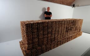 Kingsley Baird with his temporary artwork, Tomb, displayed at French World War I museum, Historial de la Grande Guerre, Péronne, 2013. The sculpture, a 1:1 ‘copy’ of Sir Edwin Lutyens’s "Stone of Remembrance" was composed of about 18,000 soldier-shaped biscuits.
