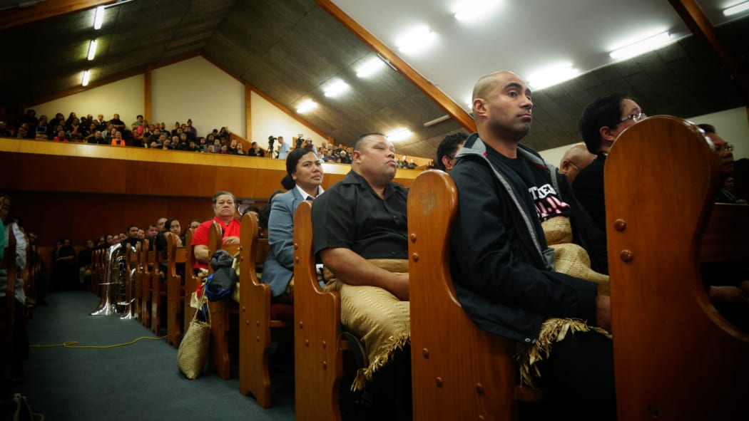 More than 600 people attended the service, including Jonah Lomu's childhood friend, Sinipata Kaufononga front, seated with mourners.