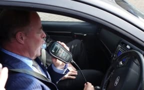 Associate Transport Minister Craig Foss demonstrated the alcohol interlock