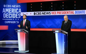 US Senator and Republican vice presidential candidate J.D. Vance (L) and Minnesota Governor and Democratic vice presidential candidate Tim Walz participate in the Vice Presidential debate hosted by CBS News at the CBS Broadcast Center in New York City on October 1, 2024. (Photo by ANGELA WEISS / AFP)
