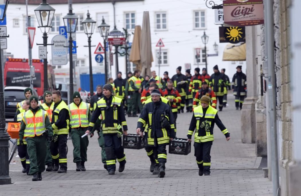 Police and paramedics during the mass evacuation to allow a World War II bomb to be defused in Augsburg, Germany.