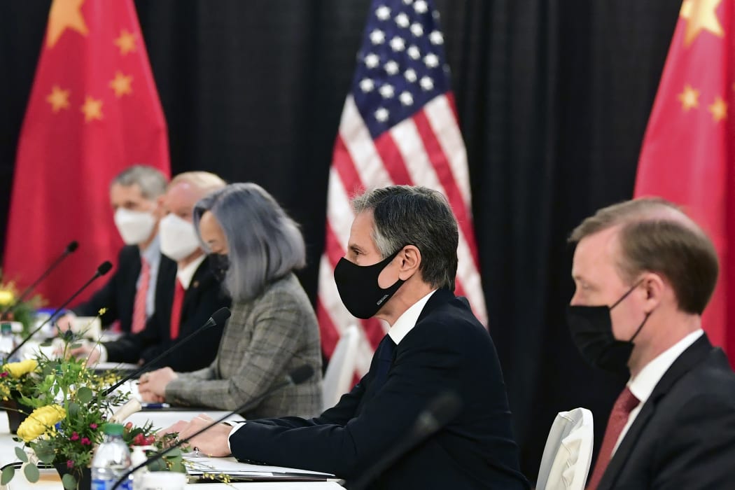 The US delegation led by Secretary of State Antony Blinken, flanked by US National Security Advisor Jake Sullivan , face their Chinese counterparts at the opening session of US-China talks at the Captain Cook Hotel in Anchorage, Alaska.