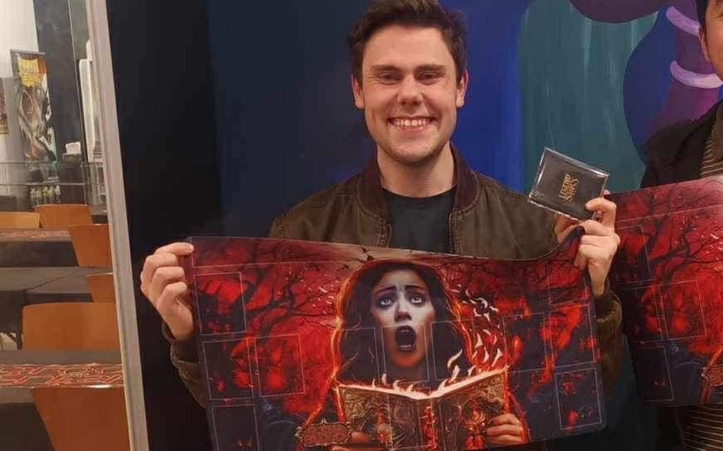 Photo of a man smiling at the camera.