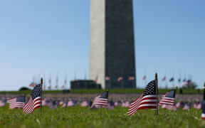 American flags placed on the National Mall by the Covid Memorial Project to represent the 200,000 Americans that have lost their lives due to the coronavirus.
