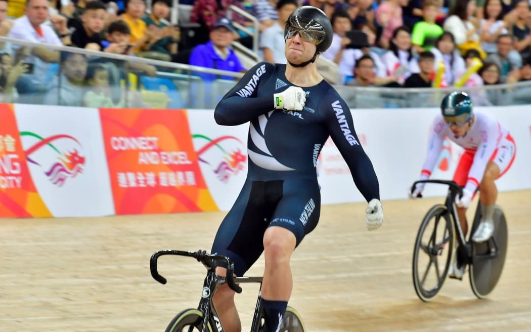Callum Saunders celebrates winning the keirin at the World Cup meet in Hong Kong.