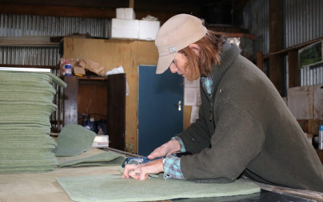Jane Schwass with a woolen exercise mat