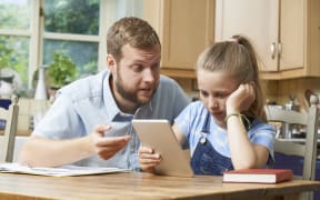 Dad Helping Girl Struggling With Studies