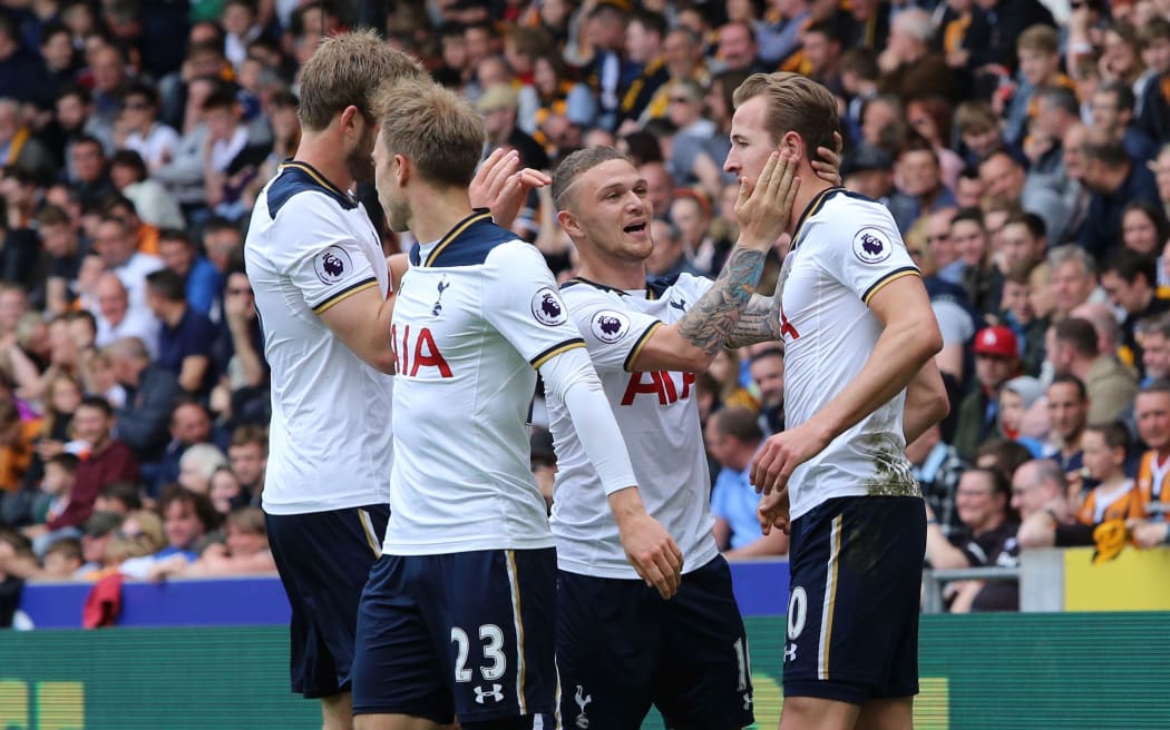 Tottenham Hotspurs players celebrate a goal.