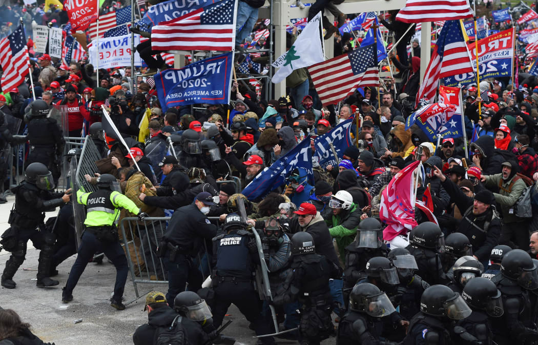 Trump supporters clash with police and security forces at the US Capitol on 6 January 2021.