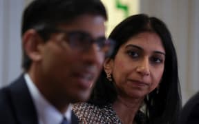 Britain's Prime Minister Rishi Sunak (L) and Britain's Home Secretary Suella Braverman attend a meeting with local community and police leaders following the announcement of a new police task force to help officers tackle grooming gangs, in Rochdale, northern England on April 3, 2023. (Photo by PHIL NOBLE / POOL / AFP)