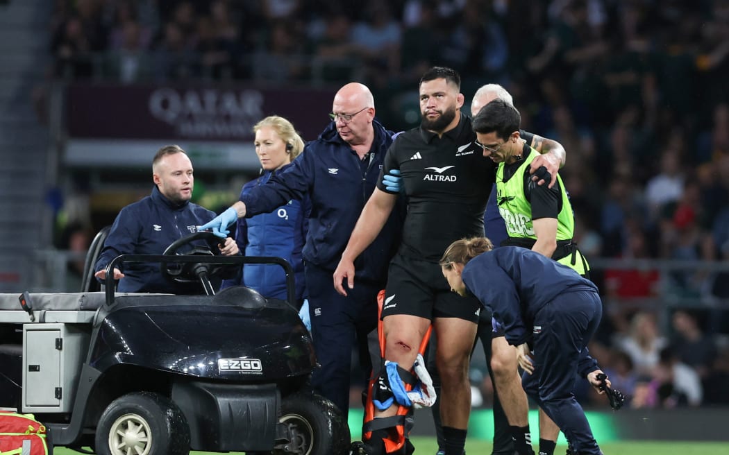 Tyrel Lomax of New Zealand taken off injured during the game against the Springboks at Twickenham 2023.