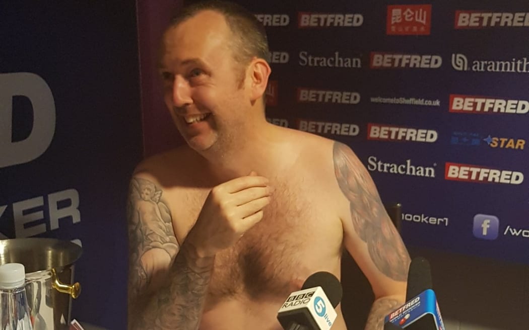 Mark Williams follows through on his promise to strip for press conference if he won.