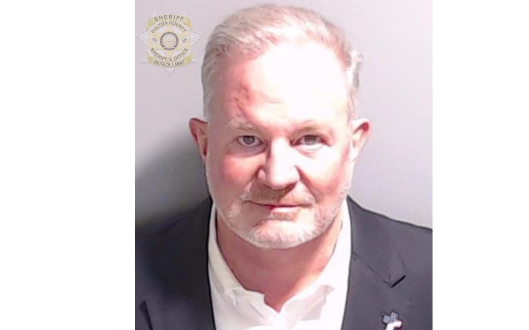 This handout image released by the Fulton County Sheriff's Office on August 23, 2023 shows the booking photo of poll watcher Scott Hall. The first co-defendants in the election racketeering case targeting former US president Donald Trump surrendered to the authorities in Georgia on August 22. John Eastman, a former campaign attorney for Trump, and Scott Hall, a bail bondsman, were booked at the Fulton County Jail, according to jail records. (Photo by FULTON COUNTY SHERIFF'S OFFICE / AFP) / RESTRICTED TO EDITORIAL USE - MANDATORY CREDIT "AFP PHOTO / FULTON COUNTY SHERIFF'S OFFICE " - NO MARKETING - NO ADVERTISING CAMPAIGNS - DISTRIBUTED AS A SERVICE TO CLIENTS