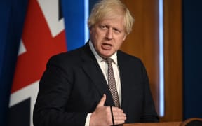 Britain's Prime Minister Boris Johnson gives an update on relaxing restrictions imposed on the country during the coronavirus Covid-19 pandemic at a virtual press conference at Downing Street on 5 July 2021.