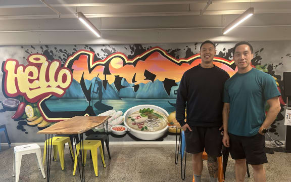A picture of two people inside a restaurant. Pictured Mike Lee and Jason Kit.
