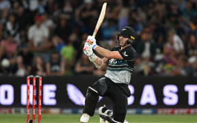 New Zealand's Michael Bracewell hits a boundary during his innings in the first T20 international against Sri Lank at Mt Maunganui, 28 December 2024.