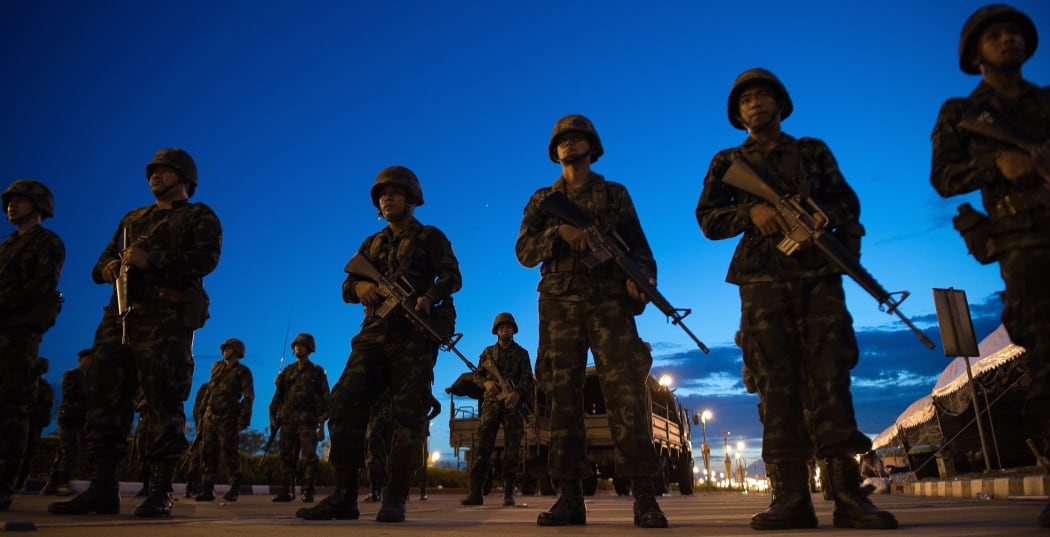 Soldiers cleared the pro-government 'Red Shirts' rally site and stood guard at the main entrance.