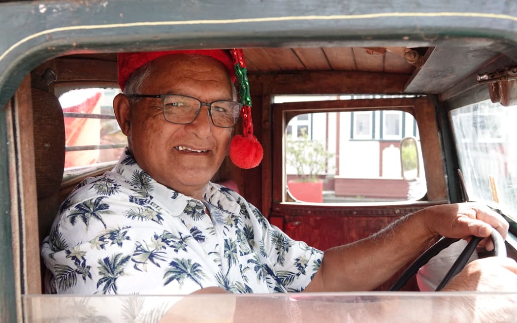 Dave Hōri drives a 1933 Chrysler Fargo standing in for Santa’s sleigh.