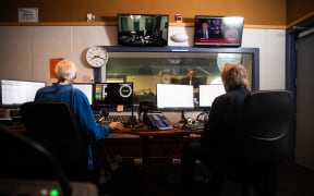A news studio, seen from behind.