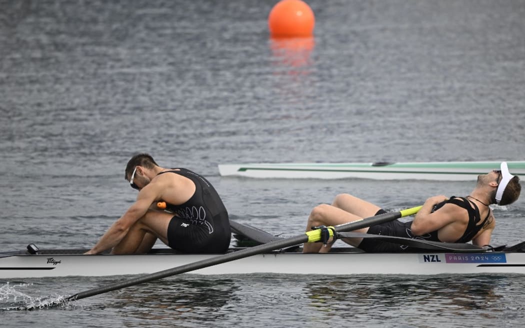 New Zealand's Phillip Wilson (L) and New Zealand's Daniel Williamson react after competing in the men's pair semifinal A/B rowing competition at Vaires-sur-Marne Nautical Centre in Vaires-sur-Marne during the Paris 2024 Olympic Games on July 31, 2024. (Photo by Olivier MORIN / AFP)