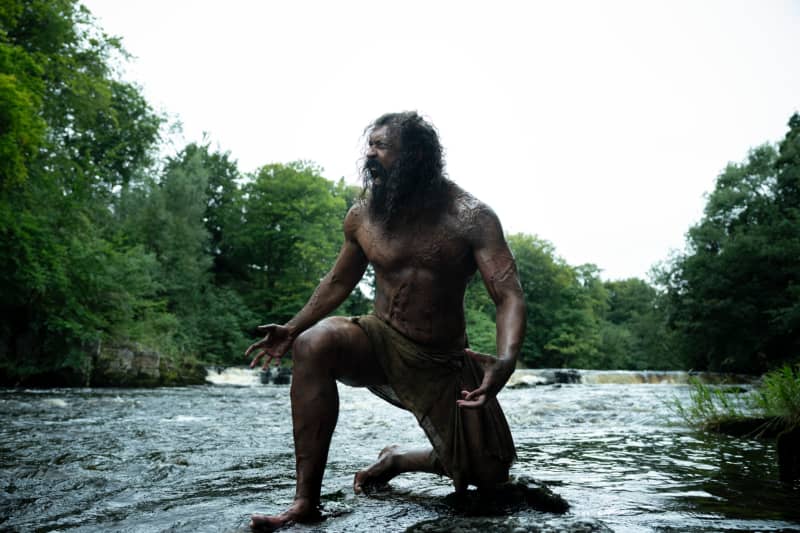 Chi Lewis-Parry as Samson in 28 Years Later: The Bone Temple (2026), kneeling down in a lake, shouting.