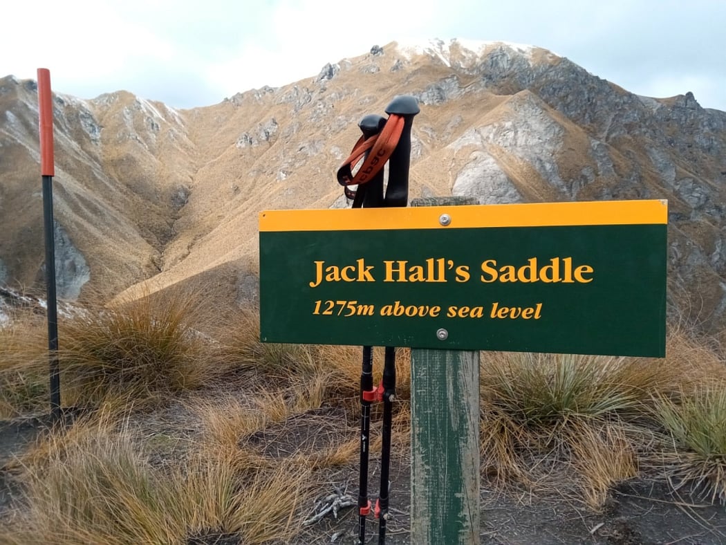 A DOC marker at the top of Jack Hall's saddle.