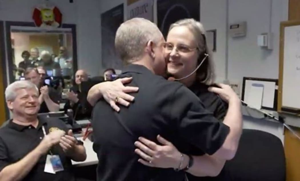 Alice Bowman is congratulated on the confirmation of flyby success.