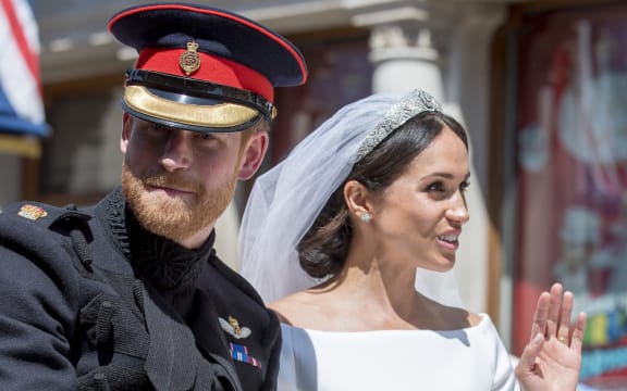 Prince Harry, Duke of Sussex and Meghan Markle, Duchess of Sussex in the Ascot Landau carriage during the procession on The Long Walk after getting married St George's Chapel, Windsor Castle.