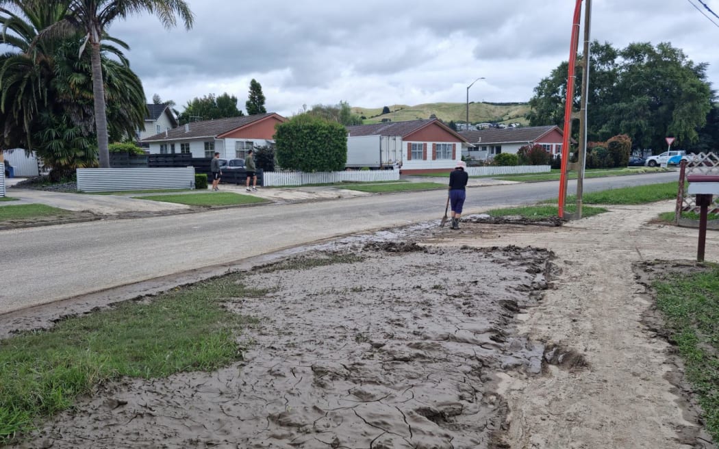 A torn up footpath covered in mud