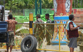 Indonesian military guard the border with Papua New Guinea