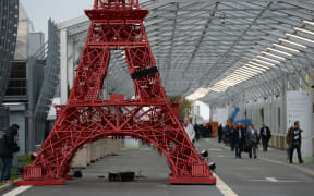 A replica of the Eiffel Tower built with Bistrot chairs installed at the climate summit's venue at Le Bourget, northeast of Paris, on November 29, 2015. AFP PHOTO / MIGUEL MEDINA