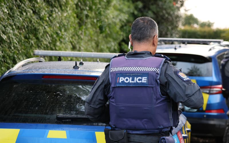 A police officer investigates alleged crime in Northland.