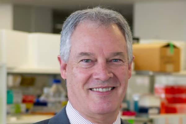 Peter Schofield is a smiling man with short grey hair and blue eyes.