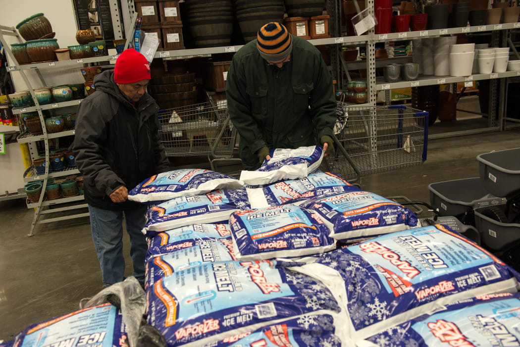 Shoppers in Brooklyn pack shopping carts with ice melt.