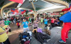 People take part in an open group Zumba session held in Mangere Town Centre
