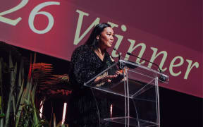 Māhera Maihi on stage accepting her award at the 2026 Kiwi Bank New Zealander Of The Year Awards.