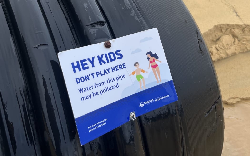 Children are warned not to play in outflow from the stormwater pipe. Photo: supplied/Bradley Reichert.