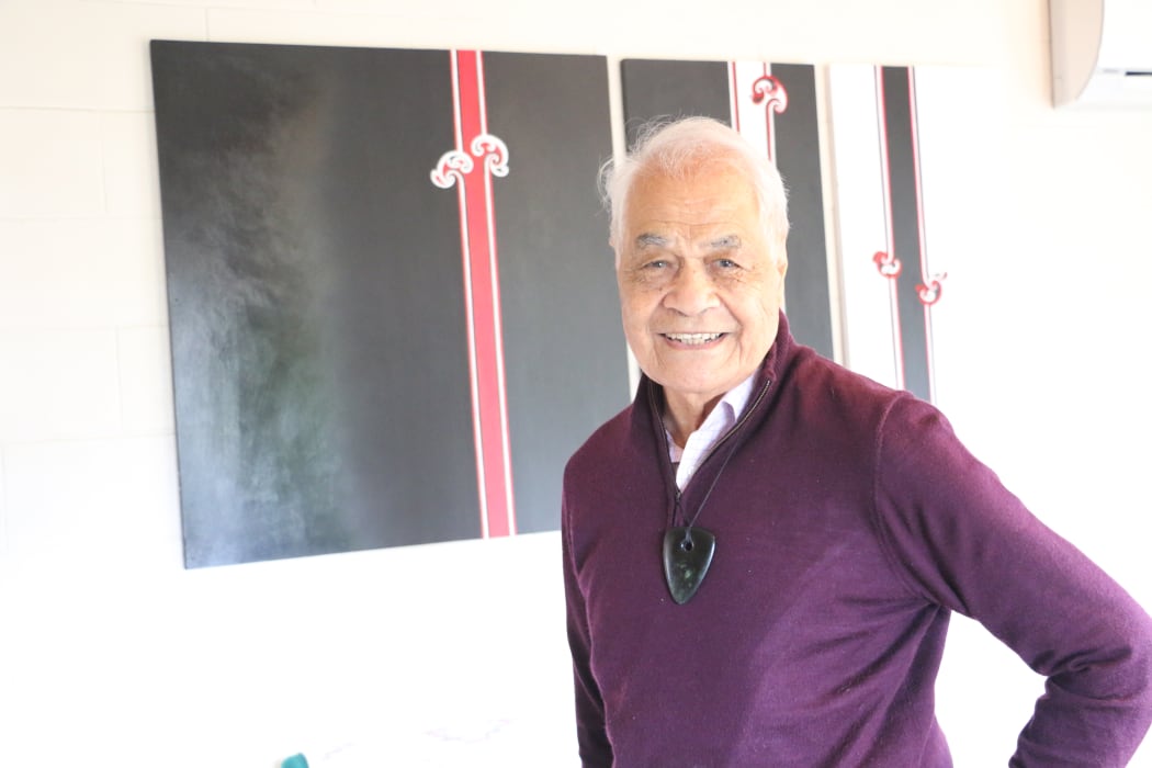 Dr Haare Williams at his Auckland home with one of his art pieces.