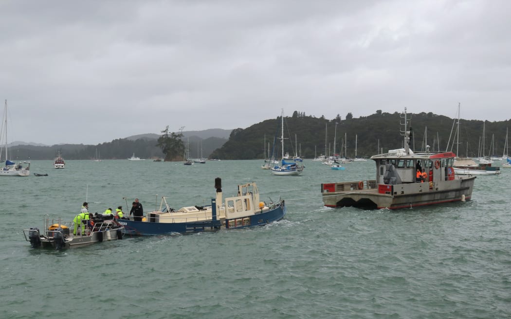 The salvaged ferry Waitere is towed to Ōpua for inspection by Maritime New Zealand investigators.