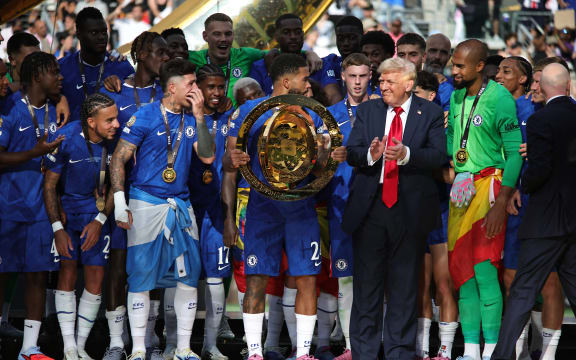 Chelsea (ENG) celebrates their championship as the FIFA Club World Cup 2025 champions by beating Paris Saint-Germain (FRA) 3-0 after an intense final at the MetLife Stadium in New Jersey, USA, on July 13, 2025, alongside US President Donald Trump and FIFA President Gianni Infantino (Photo by Deccio Serrano/NurPhoto). (Photo by DECCIO SERRANO / NurPhoto via AFP)