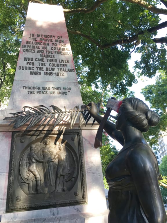 The war memorial on the corner of Symonds Street and City Road in Auckland. A The group have attached an axe to her head and a poster to the plaque that reads: “Fascism and White Supremacy are not Welcome Here.”