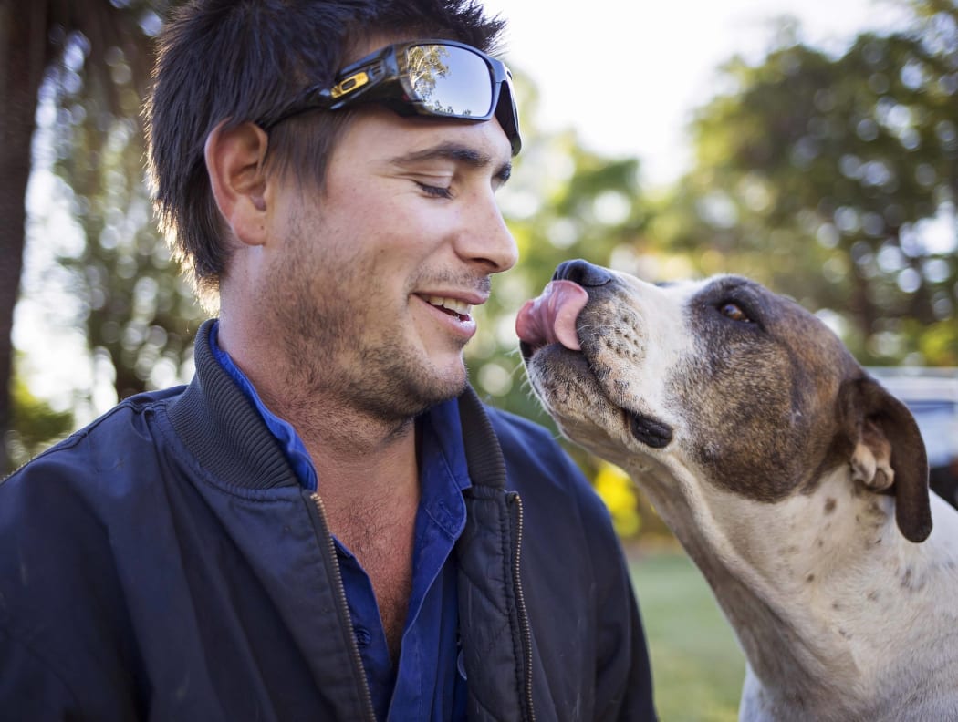 A photo of George Waghorn with a dog