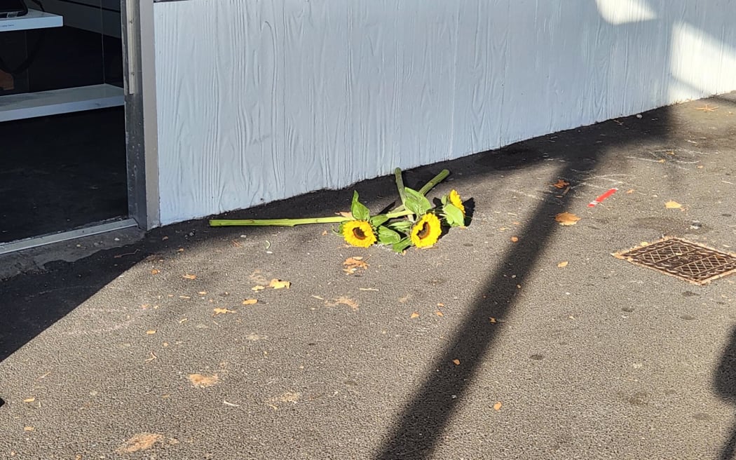 Flowers have been laid at the scene of the Ponsonby shooting on 7 May 2024.