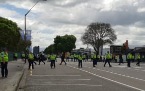Police at a protest where the New Zealand Defence Industry Association is holding its Defence, Industry and National Security Forum in Palmerston North.