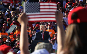 US President Donald Trump addresses thousands of supporters during a campaign rally at Phoenix Goodyear Airport October 28, 2020.