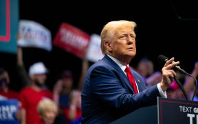 SAVANNAH, GEORGIA - SEPTEMBER 24: Republican Presidential candidate, former U.S. President Donald Trump speaks to attendees during a campaign rally at the Johnny Mercer Theatre on September 24, 2024 in Savannah, Georgia. The former president spoke to attendees on various plans including the tax code, U.S. manufacturing, and future economic opportunities if reelected for a second term. Trump continues campaigning around the country ahead of the November 6 presidential election.   Brandon Bell/Getty Images/AFP (Photo by Brandon Bell / GETTY IMAGES NORTH AMERICA / Getty Images via AFP)