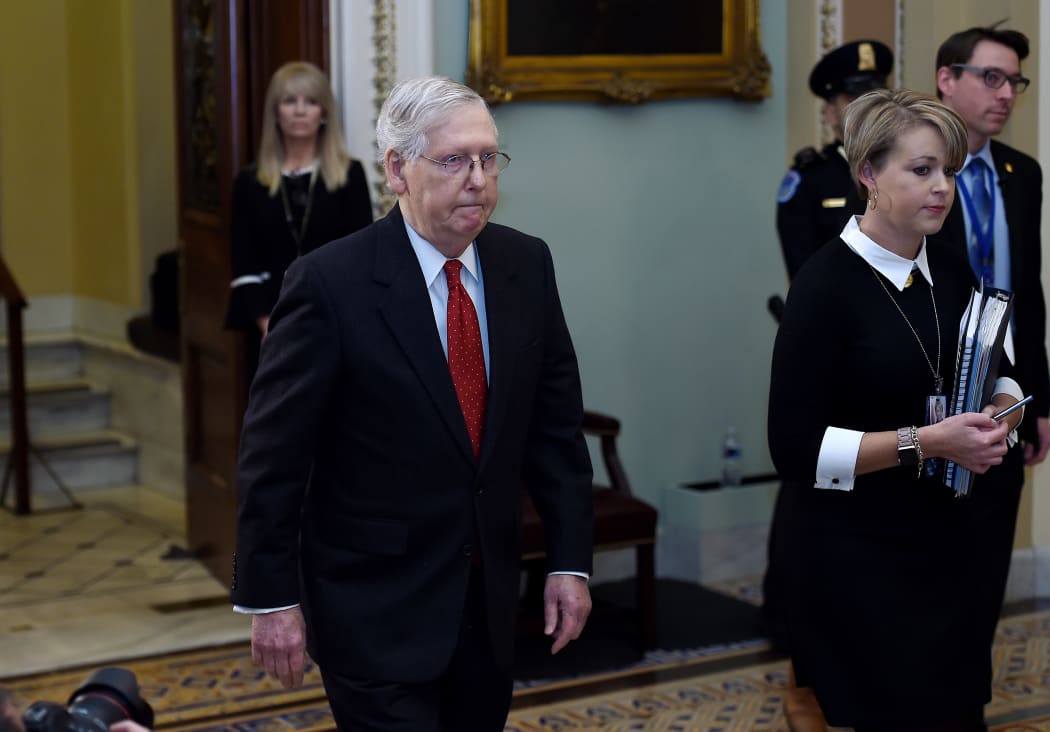 Senate Majority Leader Mitch McConnell leaves the Senate Chamber during the first day of US President Donald Trump's impeachment trial in the Senate, January 21, 2020.